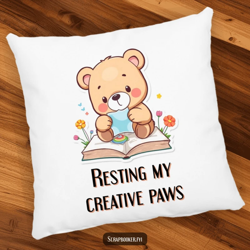 Funny bear pillow with a bear carefully placing a sticker on a colourful page, offering cozy comfort. Perfect gift.