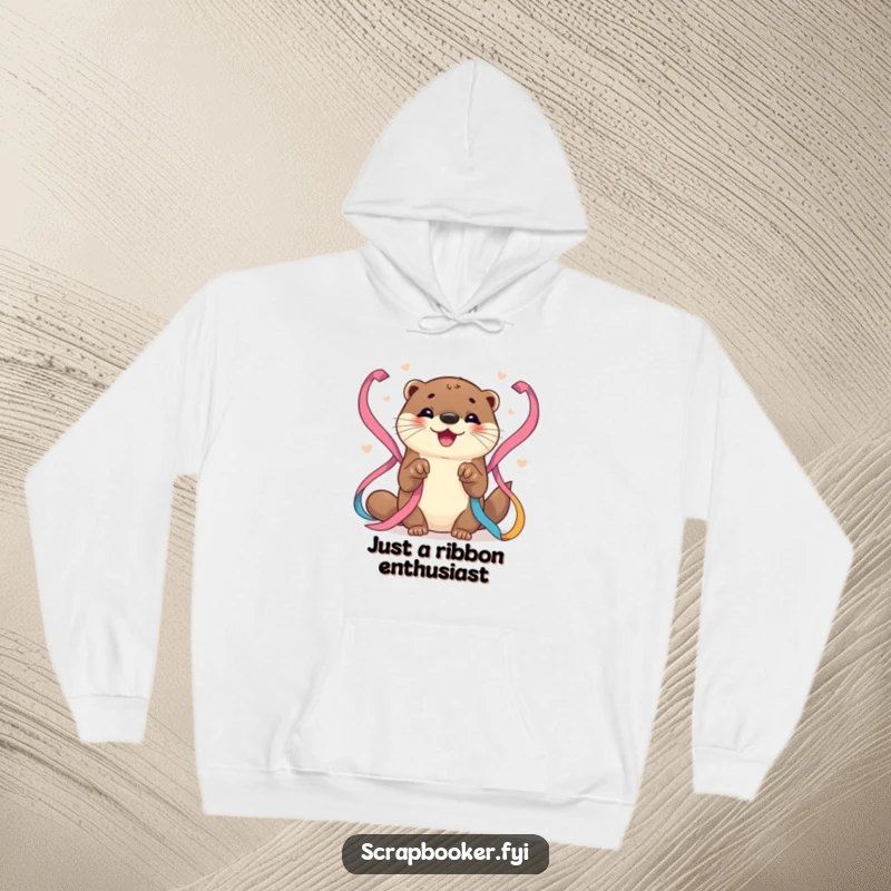 Funny Otter Hoodie: Soft, warm hoodie showcasing a happy otter meticulously arranging bright ribbons with dedicated paws, a cute craft.