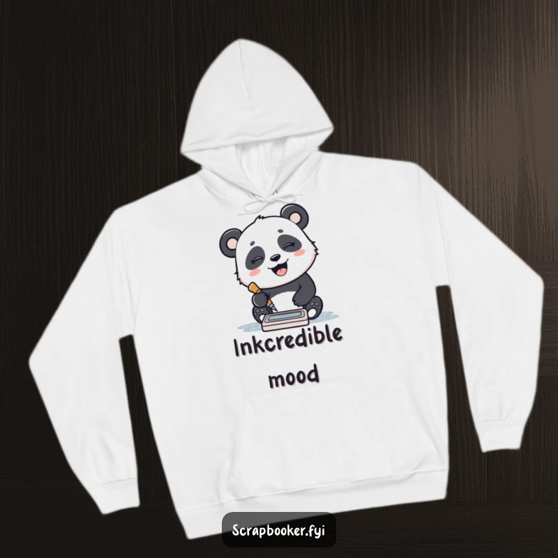 Funny hoodie with a giggling panda stamping a pattern with an ink pad, offering warmth and joyful vibes.