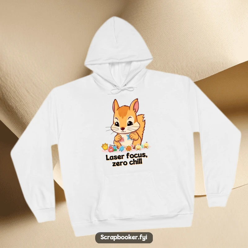 Funny hoodie showing a squirrel with a determined expression arranging tiny stickers, excellent for crafters and gift shopping.