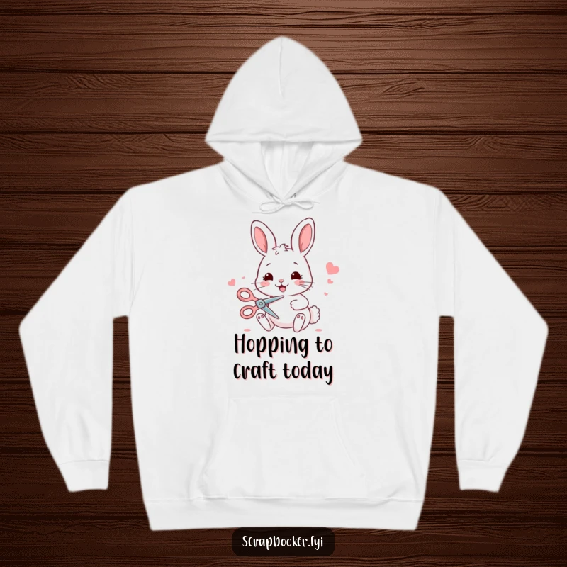 Funny bunny hoodie depicting a joyful bunny using scissors for crafting, ideal for cozy and humorous wear.