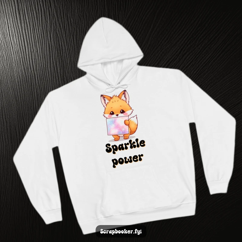 Funny hoodie featuring a fluffy fox cub holding a giant sheet of sparkly stickers, radiating happiness.