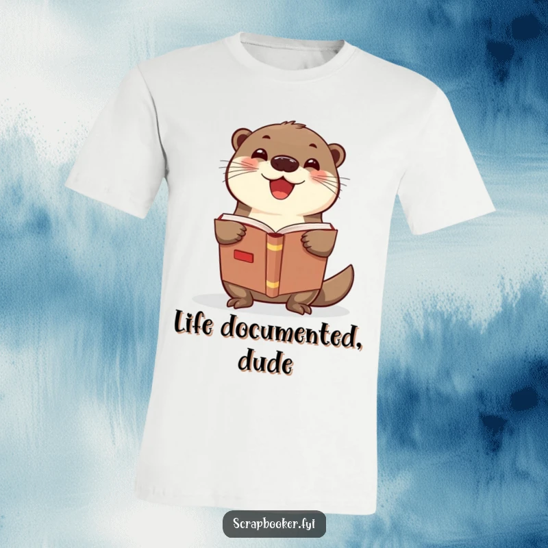 Funny otter t-shirt featuring a delighted otter holding a scrapbook, ideal for craft enthusiasts and as a funny gift.